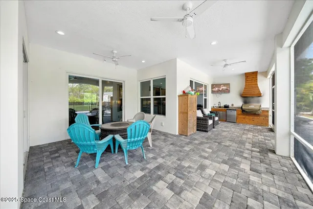 a view of a backyard with sitting area