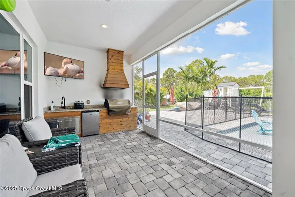 a view of a lake and green valley