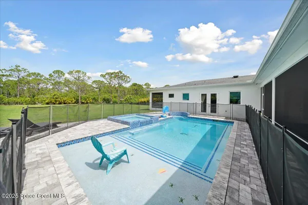 a view of workspace with furniture and a window