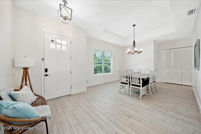 a view of a dining room with furniture window and outside view