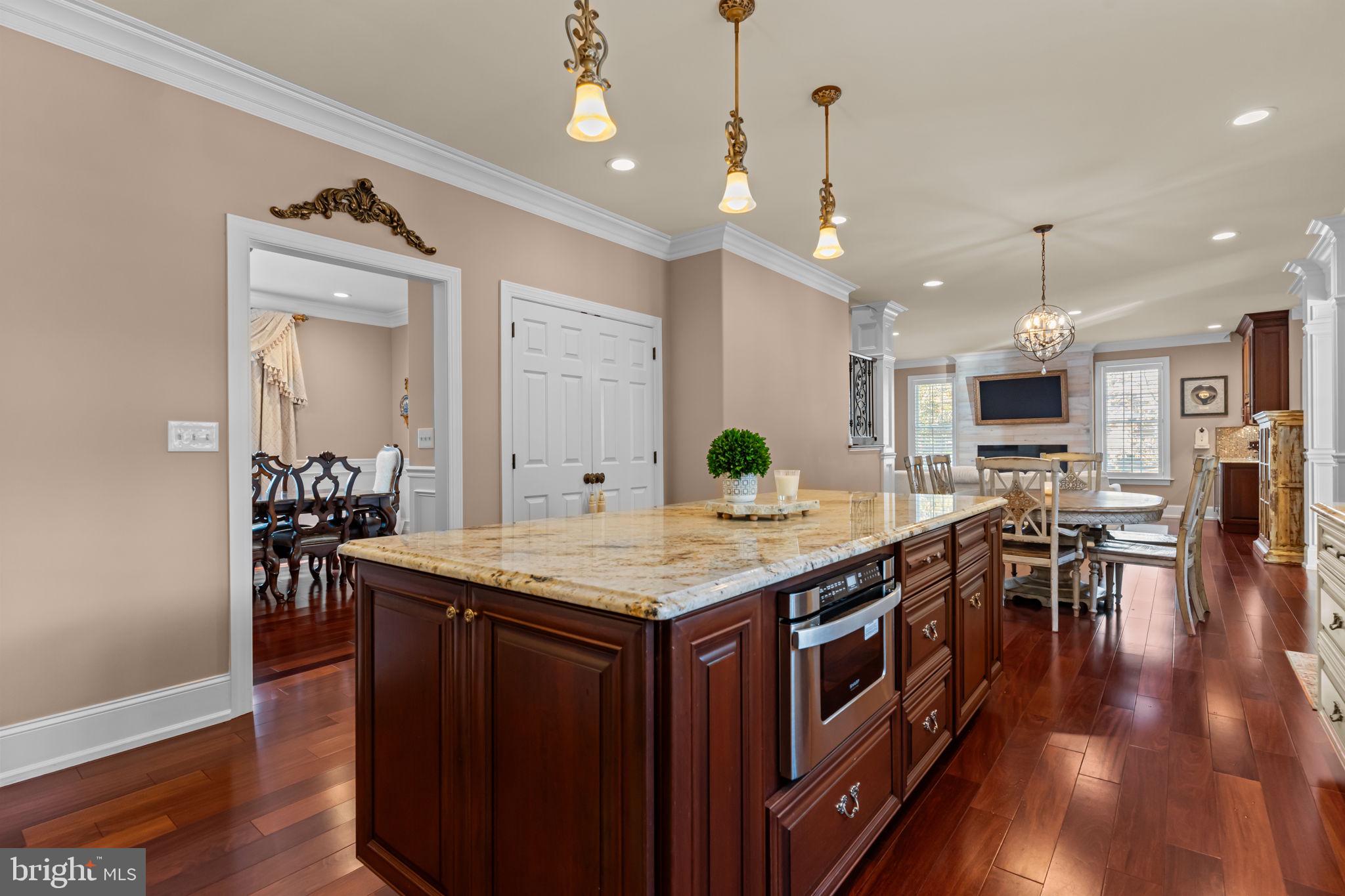 201 Golf Hills Road Havertown, PA 19083 - Photo 23 of 71 a kitchen with stainless steel appliances granite countertop a kitchen island a stove and a wooden floors