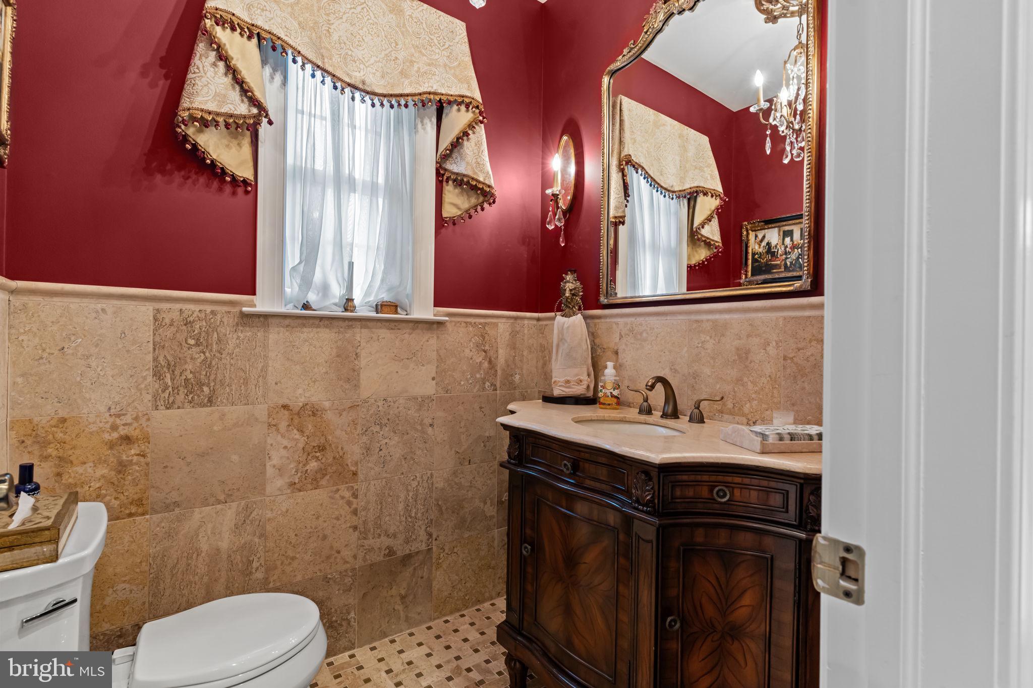 201 Golf Hills Road Havertown, PA 19083 - Photo 32 of 71 a bathroom with a granite countertop toilet sink and mirror
