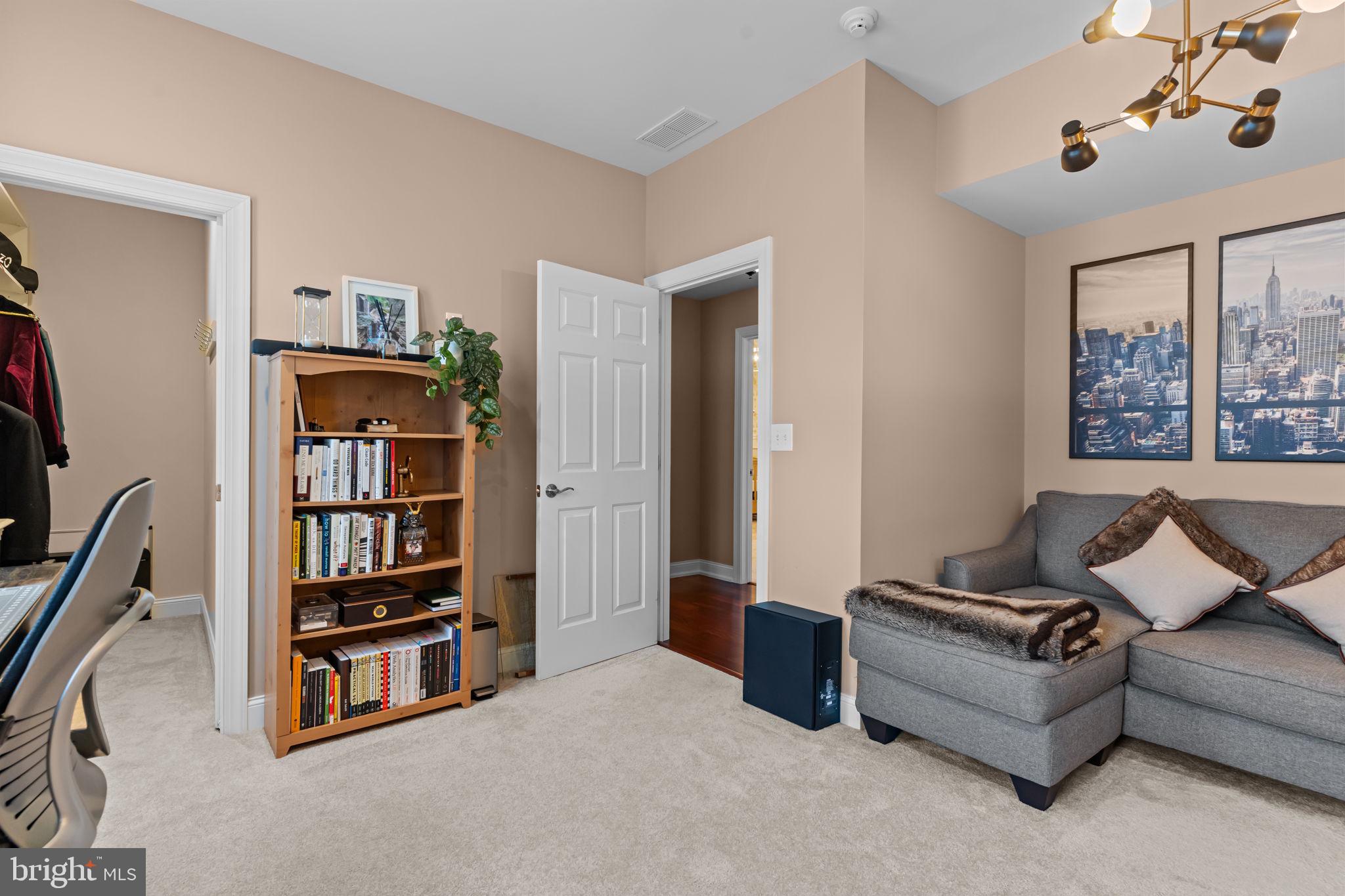 201 Golf Hills Road Havertown, PA 19083 - Photo 39 of 71 a living room with furniture and a book shelf