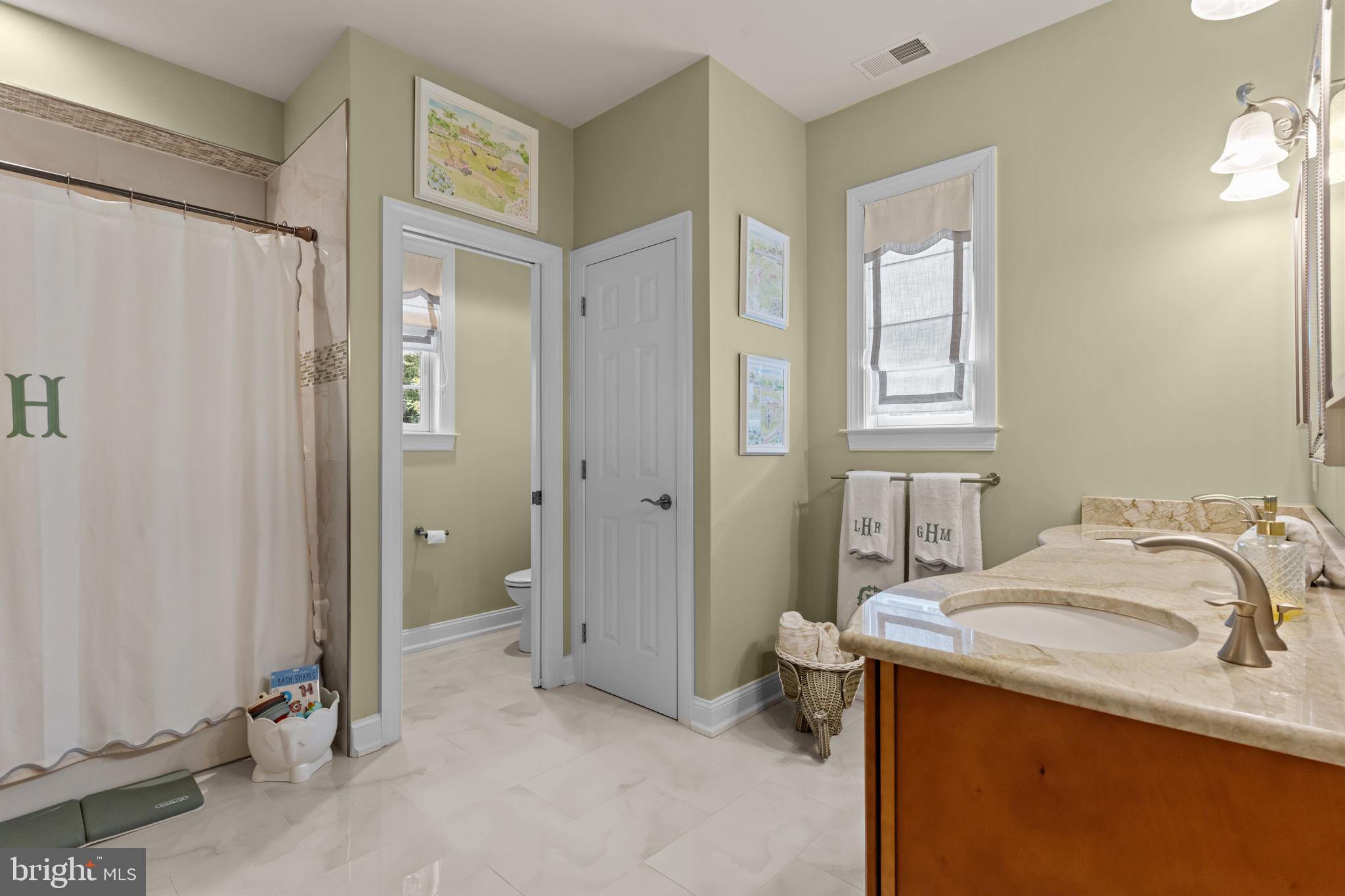 201 Golf Hills Road Havertown, PA 19083 - Photo 41 of 71 a bathroom with a granite countertop sink and a mirror