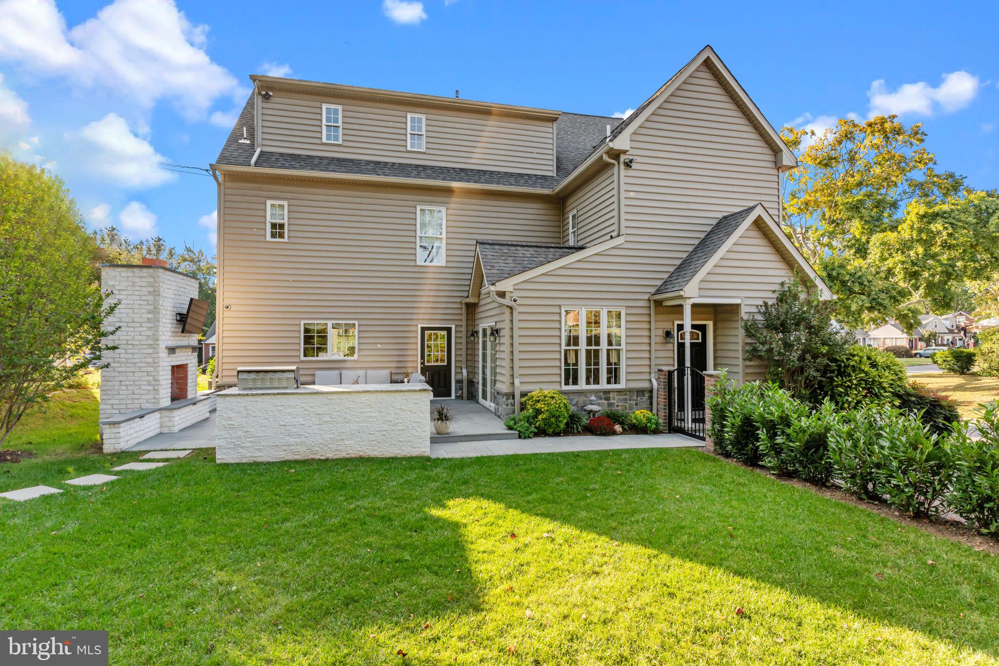 201 Golf Hills Road Havertown, PA 19083 - Photo 52 of 71 a front view of a house with a garden and yard