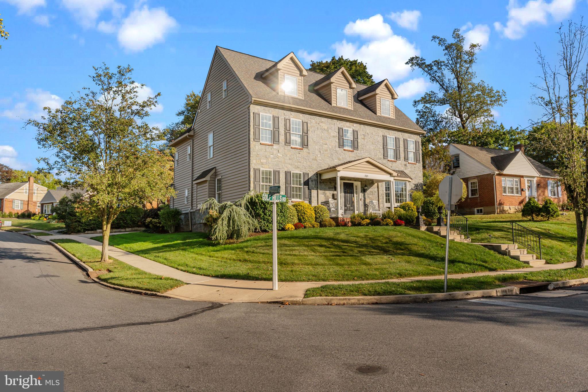 201 Golf Hills Road Havertown, PA 19083 - Photo 57 of 71 a view of a white house with a yard and plants