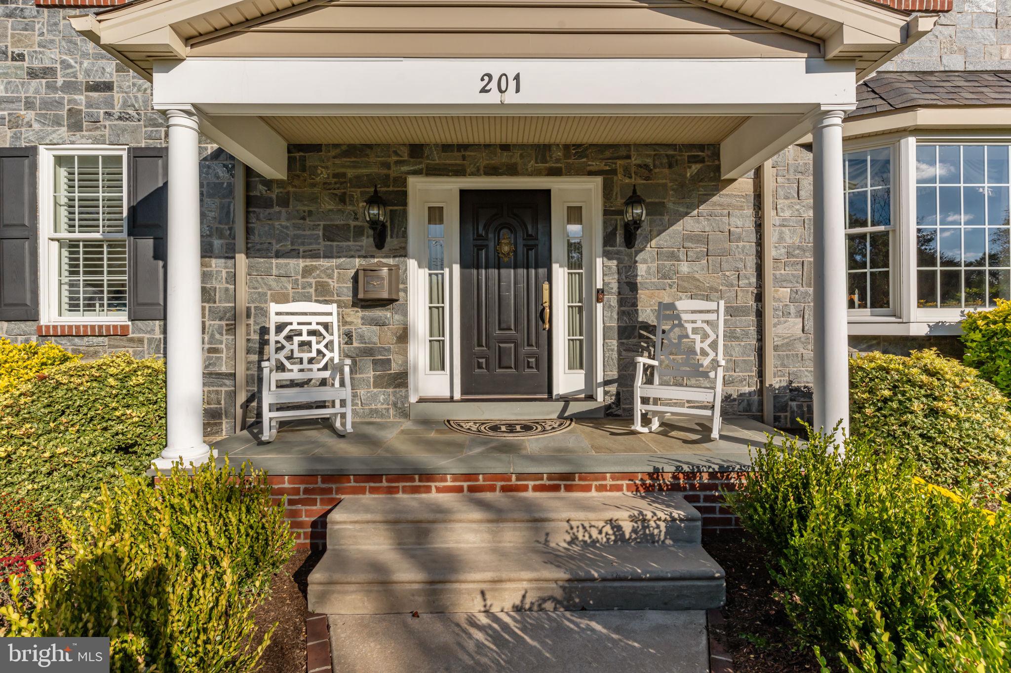 201 Golf Hills Road Havertown, PA 19083 - Photo 6 of 71 front view of a building with a garden