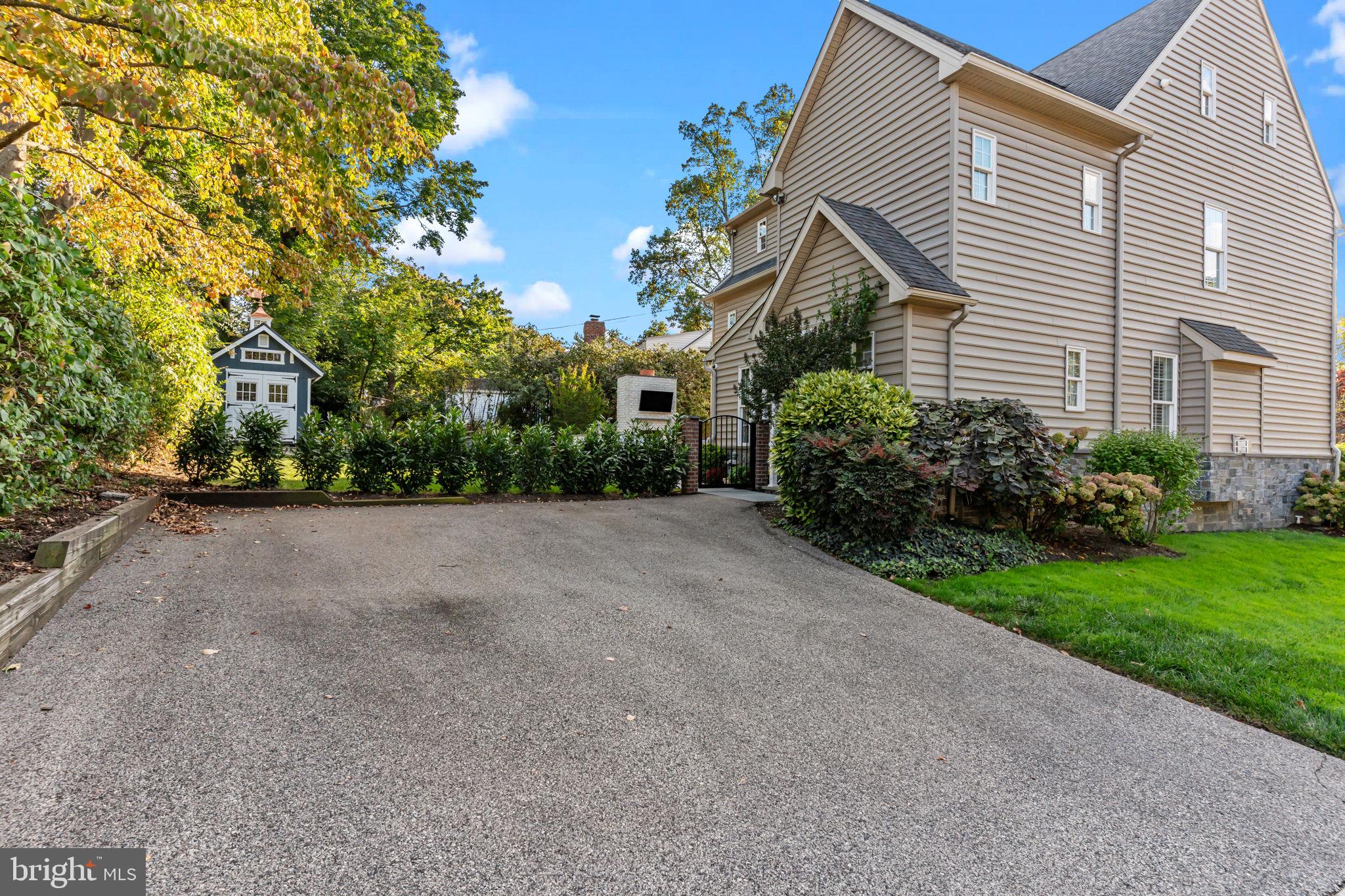 201 Golf Hills Road Havertown, PA 19083 - Photo 65 of 71 a front view of a house with a yard and garage