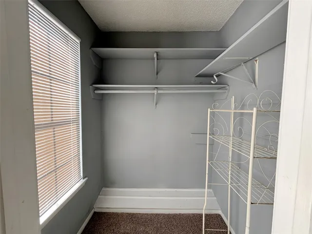 a view of walk in closet with window