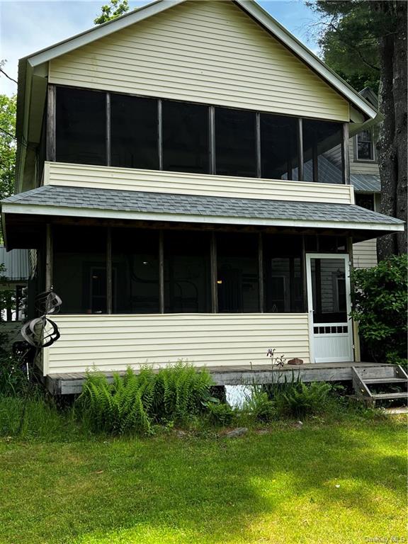 302 Todd Road, Unit B Woodbourne, NY 12788 - Photo 1 of 24 a house with a yard in front of it