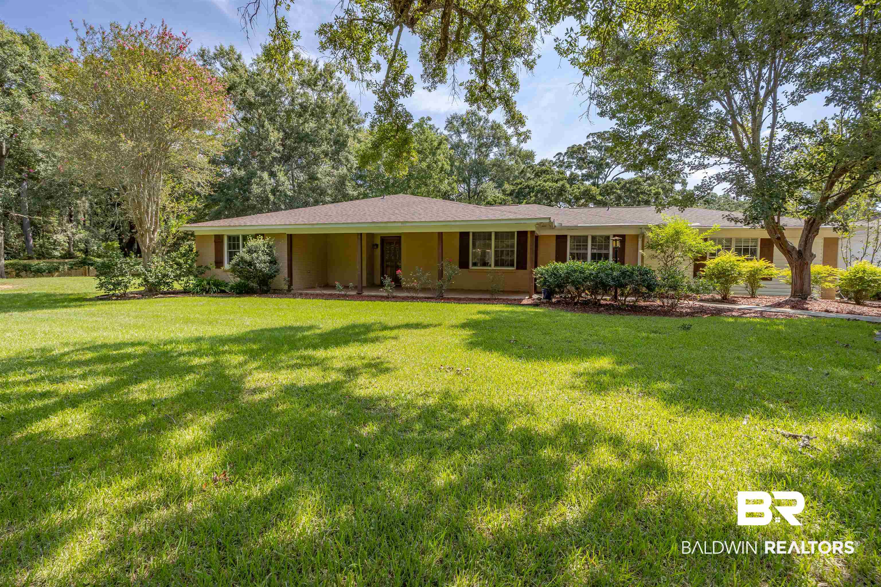 13677 Rebel Road Coden, AL 36523 - Photo 35 of 61 Single-story residence featuring a large front lawn, mature trees, and a covered porch