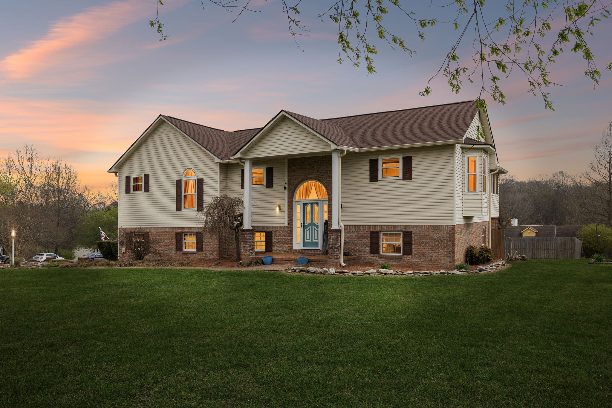 97 Oak Valley Drive Spring Hill, TN 37174 - Photo 15 of 40 a front view of a house with a garden and yard