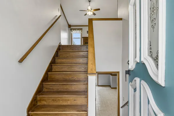 a view of entryway and hall with wooden floor