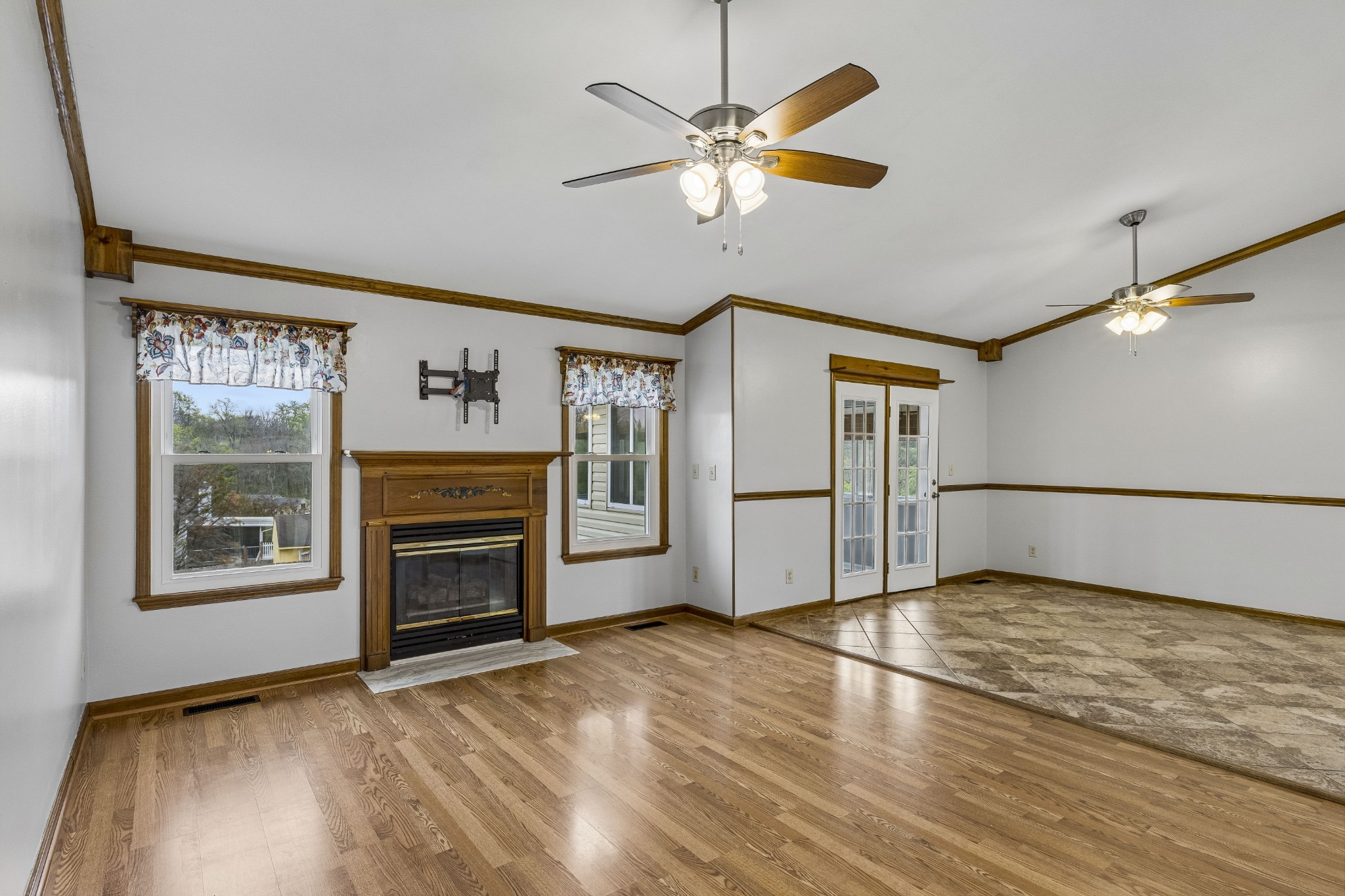 97 Oak Valley Drive Spring Hill, TN 37174 - Photo 19 of 40 a view of empty room with a fireplace and wooden floor