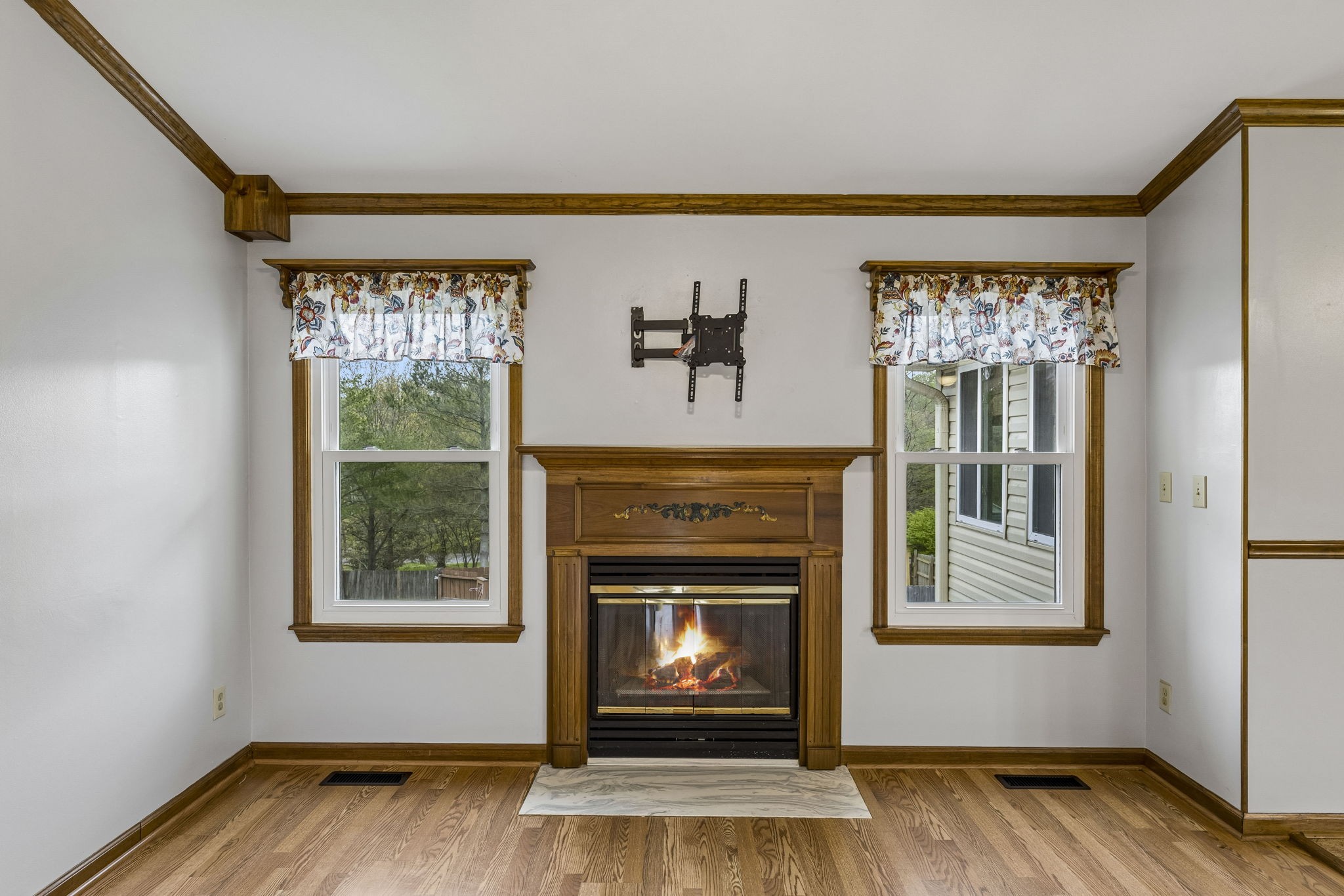 97 Oak Valley Drive Spring Hill, TN 37174 - Photo 20 of 40 a living room with fireplace and a wooden floor