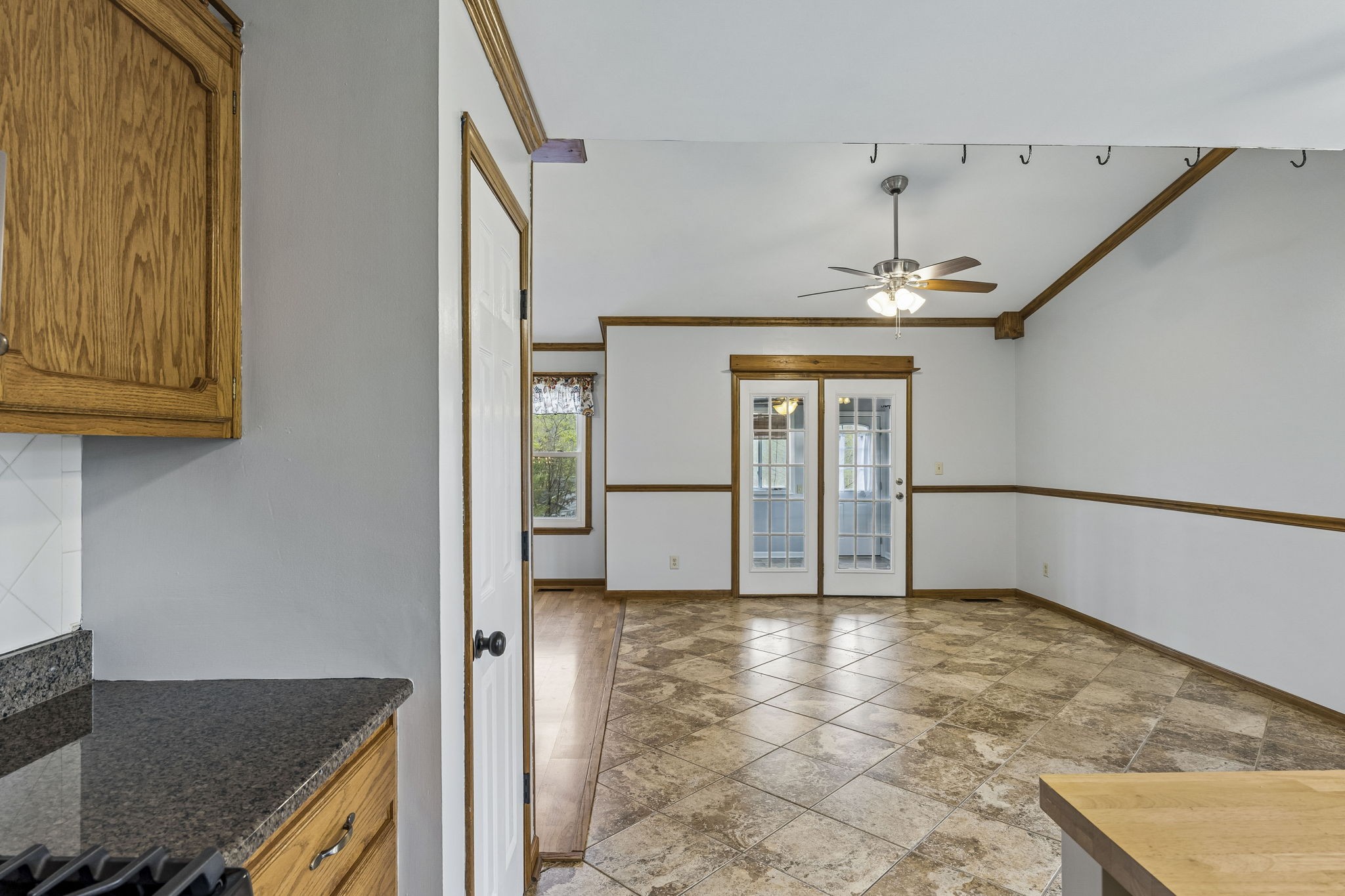 97 Oak Valley Drive Spring Hill, TN 37174 - Photo 25 of 40 a view of a refrigerator in kitchen and an empty room