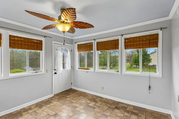 a view of an empty room with a window
