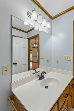 a bathroom with a sink double vanity and a mirror