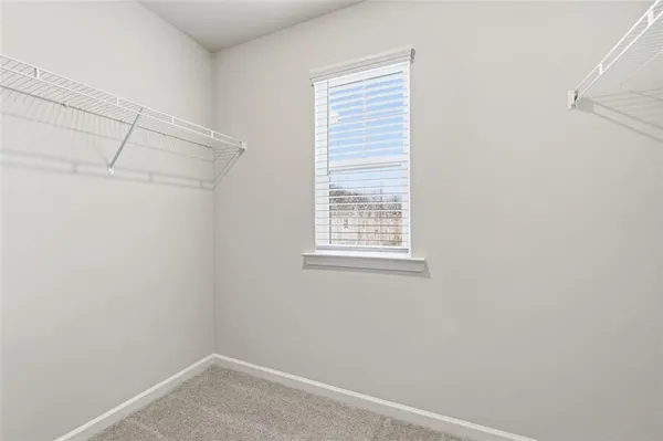 a view of a small space with racks on the wall