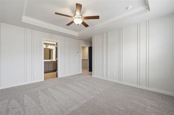 a view of an empty room and closet area