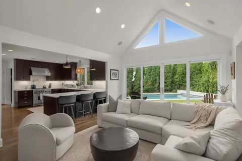 a kitchen with stainless steel appliances a sink stove and refrigerator