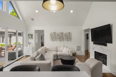 a view of a workspace with furniture and a potted plant