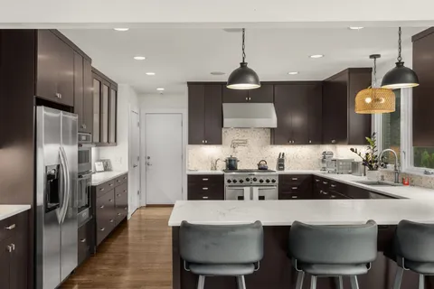 a bathroom with a shower and a sink