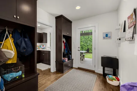 an aerial view of a house with a yard and trees