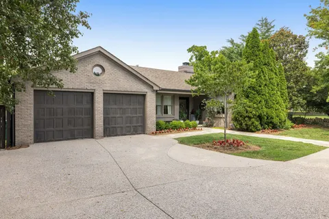 a view of living room with furniture and a potted plant