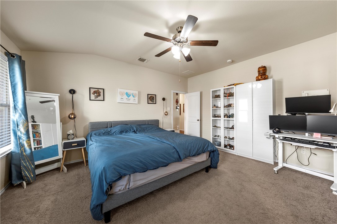 11220 Haviture Way Waco, TX 76708 - Photo 14 of 23 a bedroom with a bed furniture and a flat screen tv