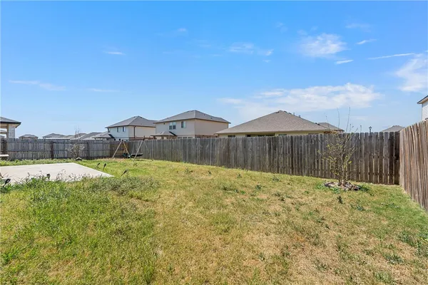 a swimming pool with wooden fence