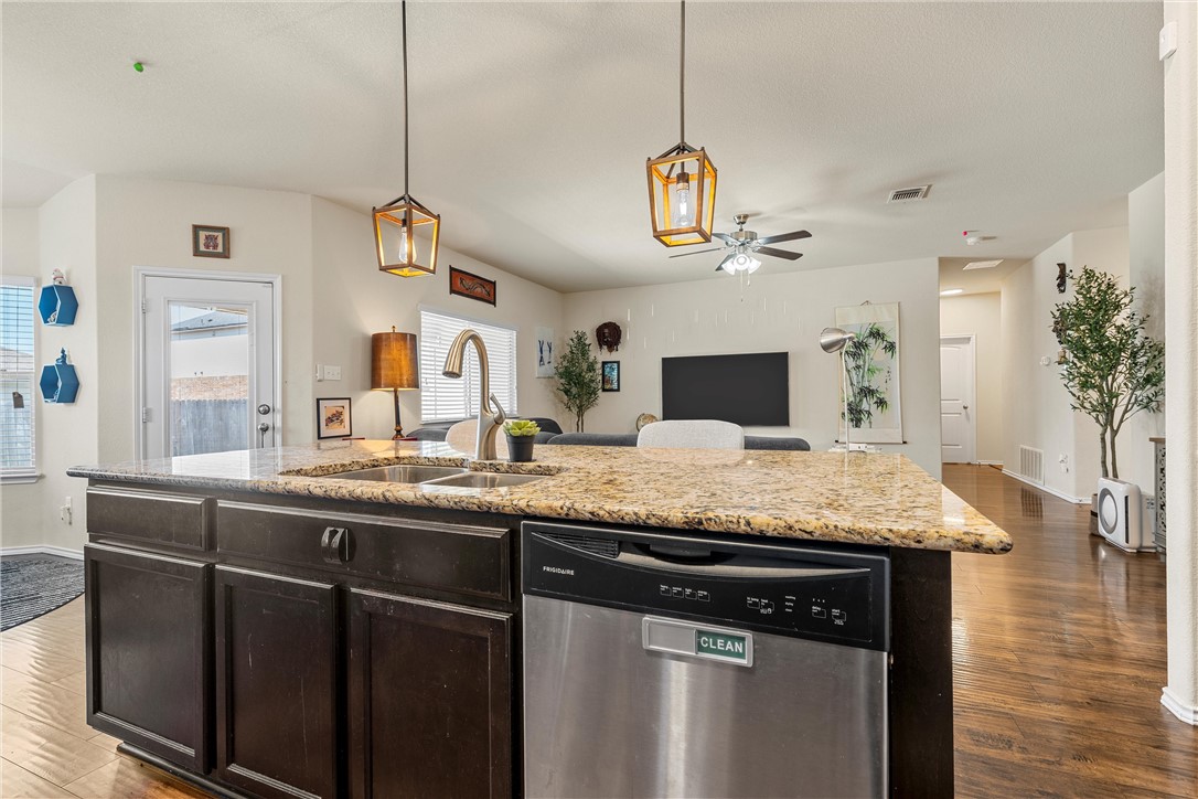 11220 Haviture Way Waco, TX 76708 - Photo 9 of 23 a kitchen with a counter space a sink and appliances