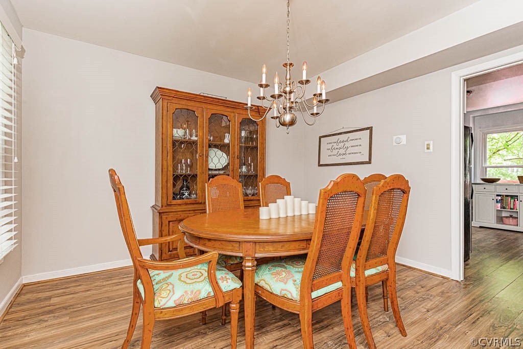 5817 Mill Spring Road Midlothian, VA 23112 - Photo 12 of 29 a dining room with furniture and chandelier