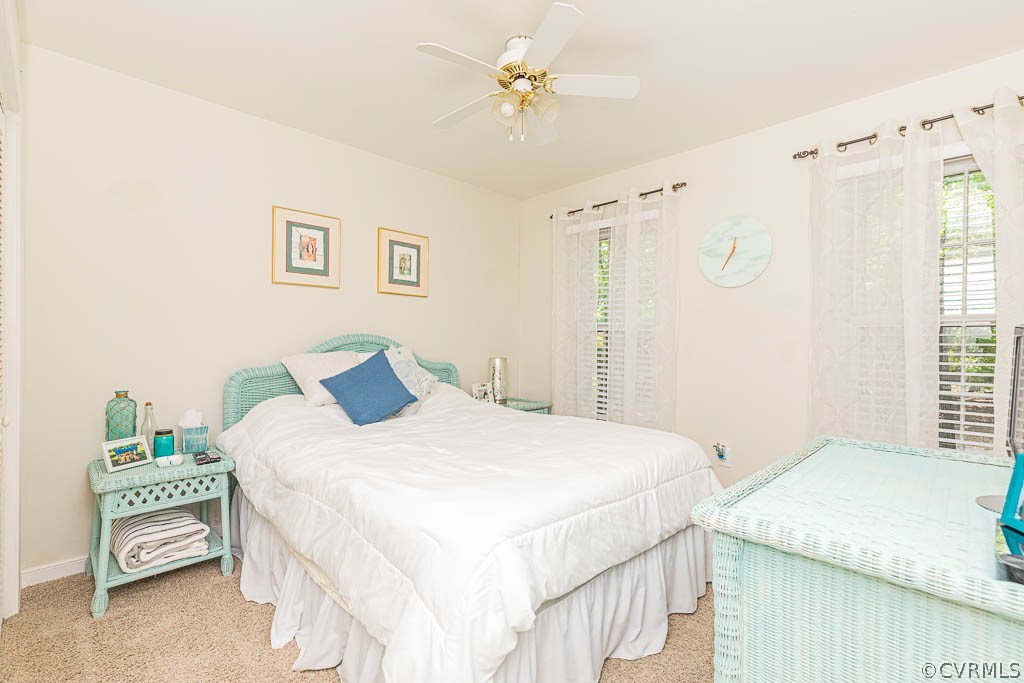 5817 Mill Spring Road Midlothian, VA 23112 - Photo 18 of 29 a bedroom with a bed and a chandelier