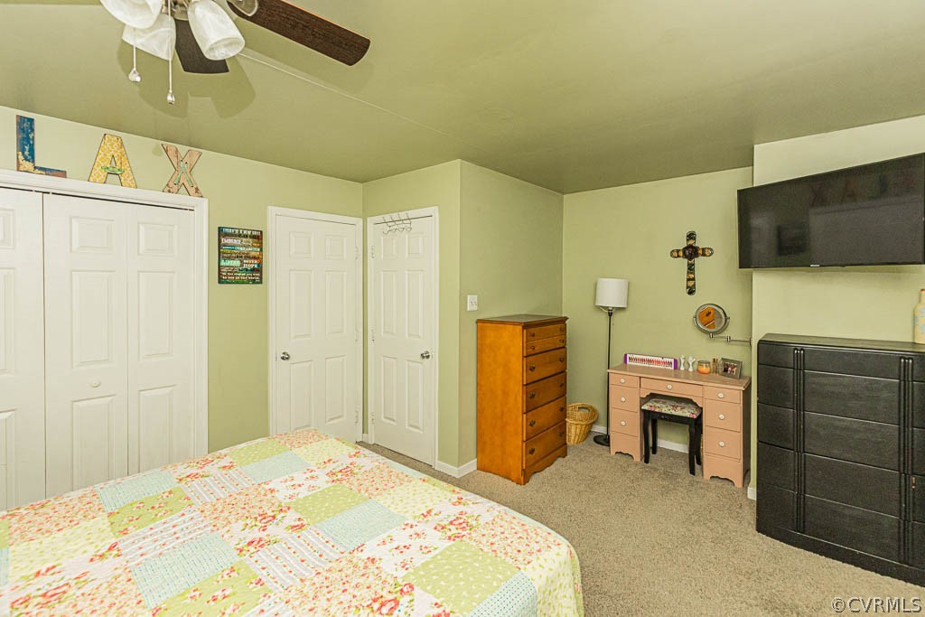 5817 Mill Spring Road Midlothian, VA 23112 - Photo 20 of 29 a bedroom with a bed and a flat screen tv