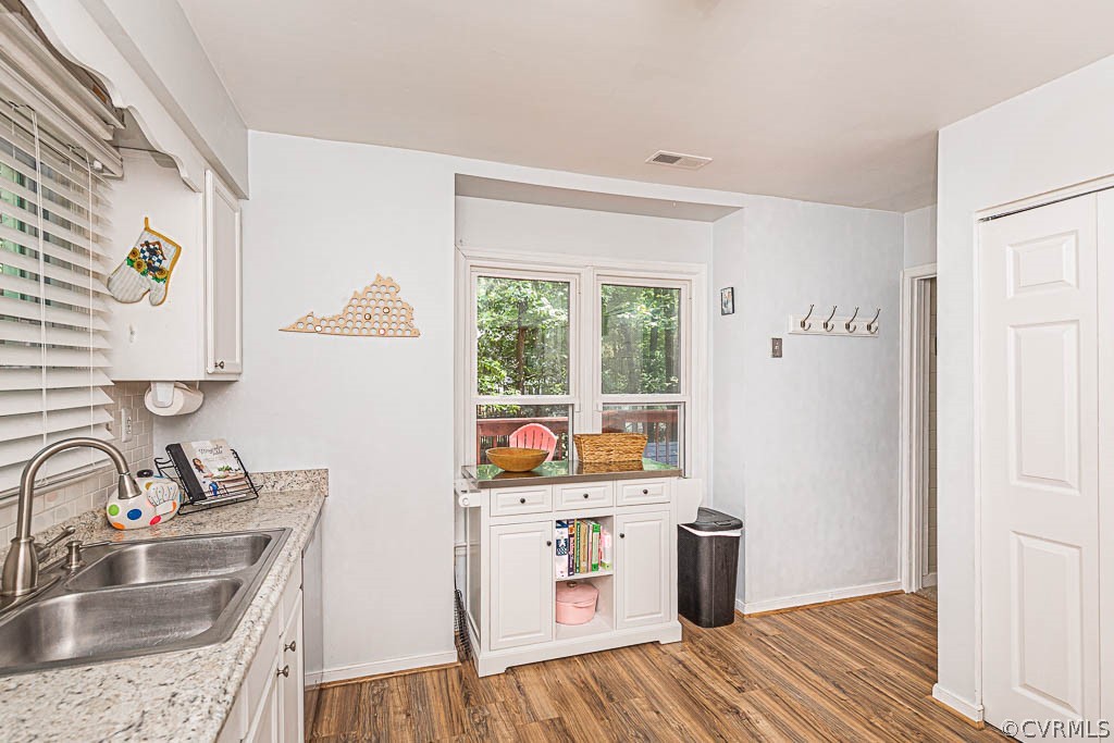 5817 Mill Spring Road Midlothian, VA 23112 - Photo 5 of 29 a kitchen with a sink stove and wooden floor
