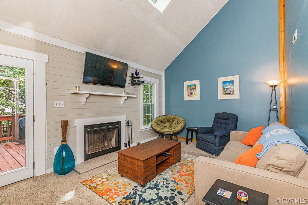 5817 Mill Spring Road Midlothian, VA 23112 - Photo 7 of 29 a living room with furniture a flat screen tv and a fireplace