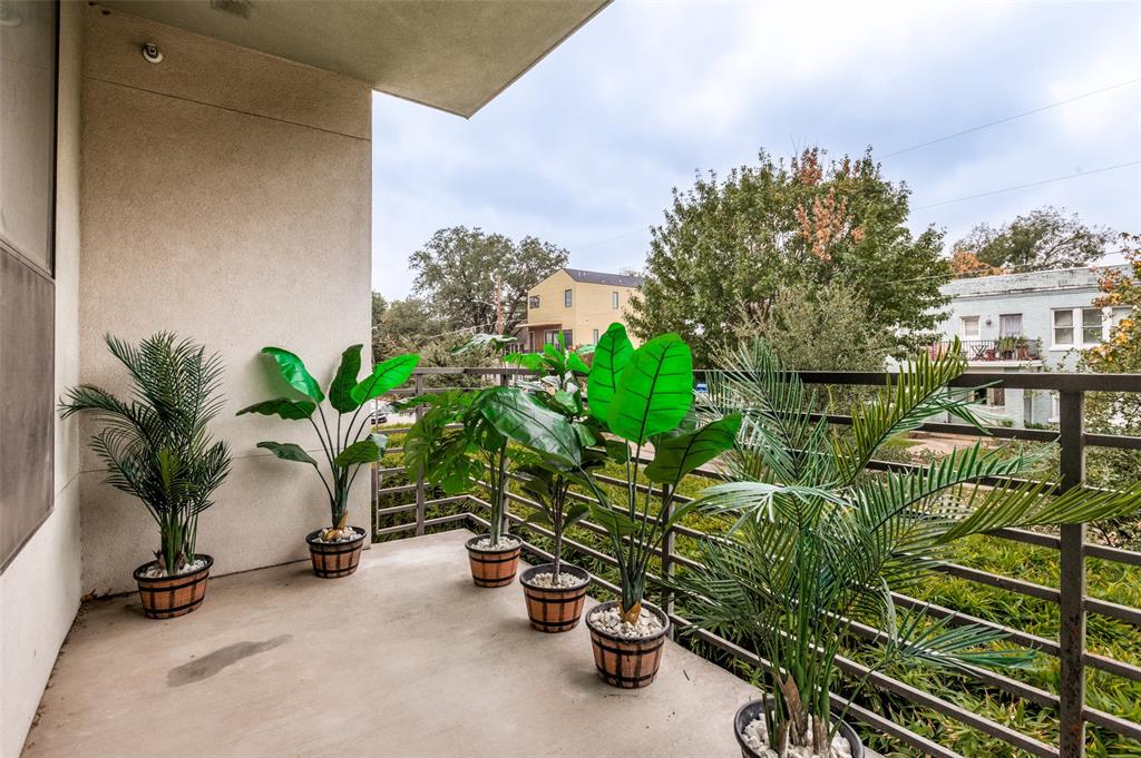 4040 North Hall Street, Unit 105 Dallas, TX 75219 - Photo 25 of 25 a view of a house with a street