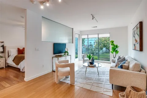 a living room with furniture or couch and a flat screen tv