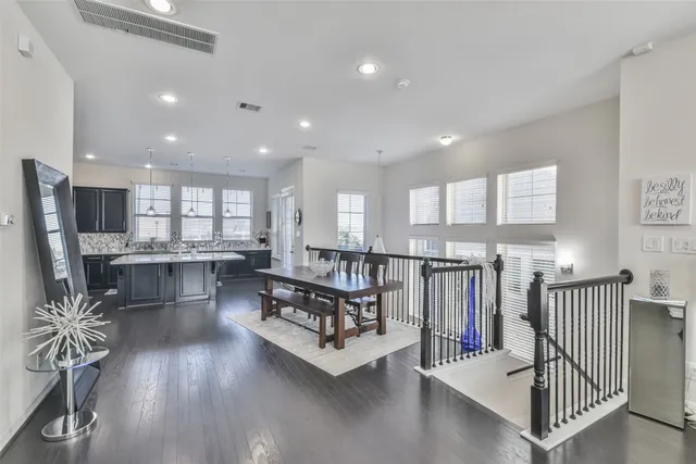 a living room with lots of furniture and a large window