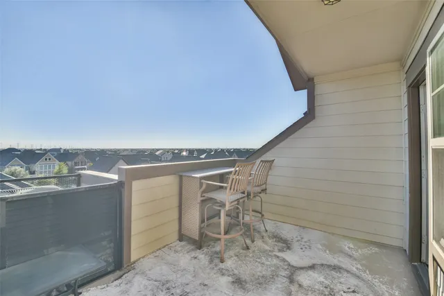 a terrace with a table and chairs