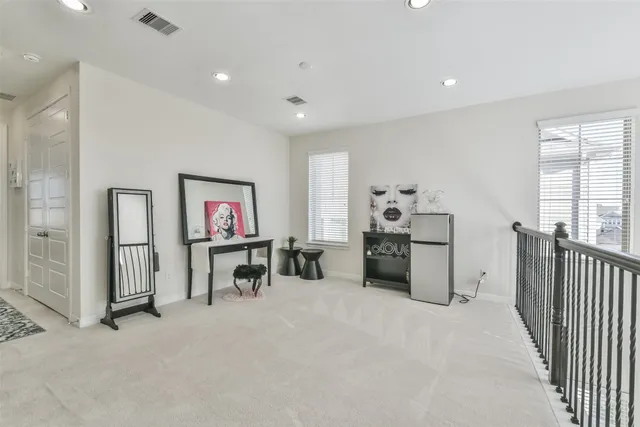 a view of a livingroom with workspace and furniture