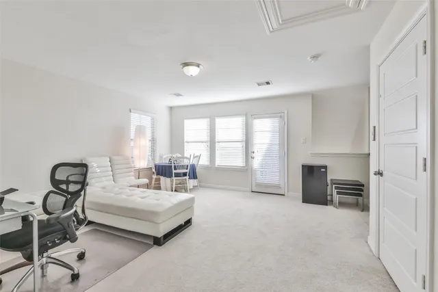 a spacious bedroom with a bed and furniture