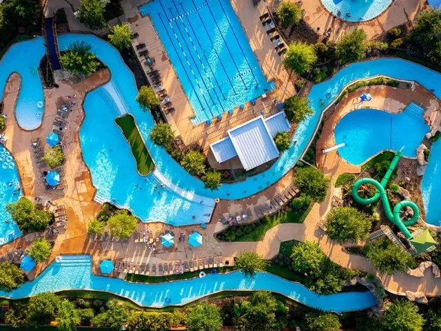 an aerial view of a house a swimming pool outdoor seating and outdoor space