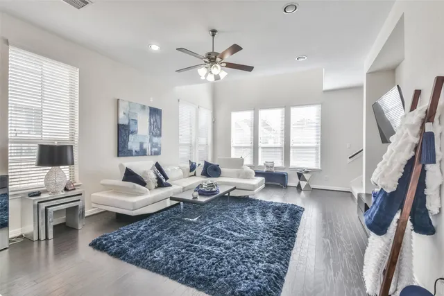 a living room with furniture and a rug