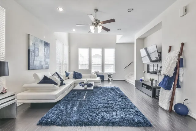 a living room with furniture and a rug
