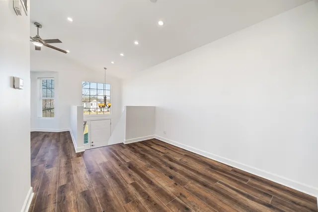a view of livingroom with hardwood floor and kitchen view