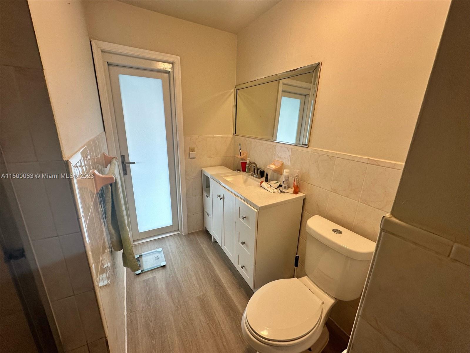 2131 Southwest 98th Place Miami, FL 33165 - Photo 11 of 22 a white toilet sitting next to a bathroom sink