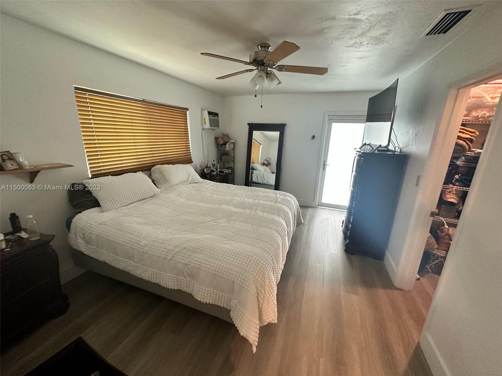 2131 Southwest 98th Place Miami, FL 33165 - Photo 12 of 22 a bedroom with bed and wooden floor