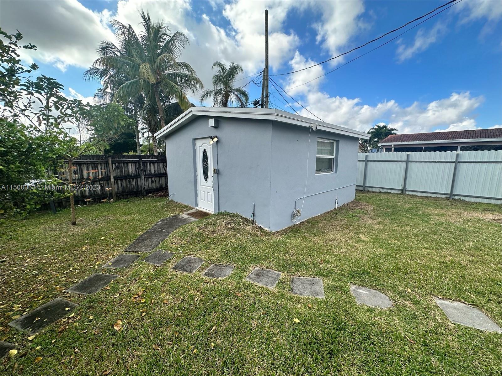 2131 Southwest 98th Place Miami, FL 33165 - Photo 13 of 22 a view of a backyard